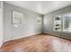 Empty bedroom with hardwood floors and multiple windows for natural light at 401 Harlan St, Indianapolis, IN 46201