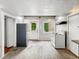 Spacious kitchen with modern appliances and a door that leads to the back at 401 Harlan St, Indianapolis, IN 46201