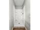An interior shot of a compact standalone shower with a white finish at 401 Harlan St, Indianapolis, IN 46201