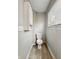 Cozy bathroom featuring a toilet and slim linen cabinet at 401 Harlan St, Indianapolis, IN 46201