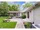 Backyard features a screen porch and patio for relaxation at 445 W 63Rd St, Indianapolis, IN 46260