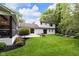 Expansive backyard featuring a charming patio and lush landscaping at 445 W 63Rd St, Indianapolis, IN 46260