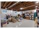 Unfinished basement with exposed ceiling and a large storage area, perfect for customization at 445 W 63Rd St, Indianapolis, IN 46260