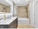 Stylish bathroom with a tub, shower, and updated fixtures, offering a spa-like experience at 445 W 63Rd St, Indianapolis, IN 46260