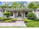Cozy front porch featuring comfortable seating and a welcoming entrance with stylish decor at 445 W 63Rd St, Indianapolis, IN 46260