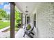 Covered front porch with seating, offering a relaxing outdoor space to enjoy the neighborhood views at 445 W 63Rd St, Indianapolis, IN 46260
