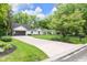 Charming single-story home featuring a manicured lawn, long driveway, and inviting curb appeal at 445 W 63Rd St, Indianapolis, IN 46260