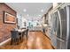 Spacious kitchen features breakfast nook, stainless appliances and gray cabinets at 445 W 63Rd St, Indianapolis, IN 46260