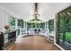 Screened-in porch with seating area and wooded views at 445 W 63Rd St, Indianapolis, IN 46260