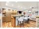 Finished basement bar area with modern seating, dark countertop, stainless fridge, and wooden cabinets at 4495 W Stones Crossing Rd, Greenwood, IN 46143
