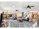 Expansive basement with leather seating, brick fireplace, and a convenient bar area at 4495 W Stones Crossing Rd, Greenwood, IN 46143