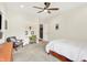 Bright bedroom with neutral walls, ceiling fan, and cozy nook featuring a built in desk at 4495 W Stones Crossing Rd, Greenwood, IN 46143
