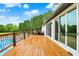 Large wooden deck with pool access and stylish railing, perfect for outdoor enjoyment at 4495 W Stones Crossing Rd, Greenwood, IN 46143