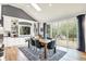 Light-filled dining room with backyard views, deck access, and built-in shelving at 4495 W Stones Crossing Rd, Greenwood, IN 46143