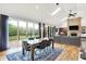 Open-concept dining area featuring sliding glass doors for outdoor access and views of the living area at 4495 W Stones Crossing Rd, Greenwood, IN 46143