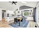 Bright dining area with a wooden table, black chairs, white cabinets, and built-in shelving at 4495 W Stones Crossing Rd, Greenwood, IN 46143