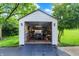 Garage with a golf cart, bicycle and other items in the garage, which also features a ramp at 4495 W Stones Crossing Rd, Greenwood, IN 46143