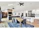 Open living space with dining area, kitchen, and living room with fireplace and comfortable seating at 4495 W Stones Crossing Rd, Greenwood, IN 46143