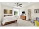 Serene bedroom featuring a ceiling fan, large windows, and a stylish en-suite bathroom at 4495 W Stones Crossing Rd, Greenwood, IN 46143