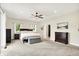 Spacious bedroom with a ceiling fan and a light neutral colored carpet at 4495 W Stones Crossing Rd, Greenwood, IN 46143