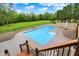 Inviting in-ground pool with lounge chairs surrounded by manicured landscaping at 4495 W Stones Crossing Rd, Greenwood, IN 46143