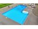 Close-up view of an inviting in-ground swimming pool with a ladder and diving board, ready for summer fun at 4495 W Stones Crossing Rd, Greenwood, IN 46143