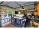 Interior shot of the storage shed featuring a golf cart, tools, and other storage items at 4495 W Stones Crossing Rd, Greenwood, IN 46143