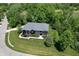 Aerial view of a large home, surrounded by mature trees and landscaping at 4691 Pascagoula Run, Greenwood, IN 46143