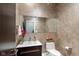 Cozy powder room with elegant textured walls, glass vessel sink, and modern fixtures at 4691 Pascagoula Run, Greenwood, IN 46143