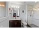 Bathroom featuring a walk-in shower, dark wood vanity, and modern fixtures at 4691 Pascagoula Run, Greenwood, IN 46143