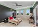 Bright bedroom with unique wall decor and ceiling fan at 4691 Pascagoula Run, Greenwood, IN 46143