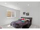 Cozy bedroom with a modern bed frame, minimalist decor, and a bright window view at 4691 Pascagoula Run, Greenwood, IN 46143