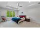 Comfortable bedroom with tray ceilings, plush carpet, and view of the surrounding landscape at 4691 Pascagoula Run, Greenwood, IN 46143