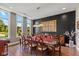 Formal dining room featuring a modern chandelier, sleek dark walls, and a classic wooden dining set at 4691 Pascagoula Run, Greenwood, IN 46143