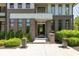 Inviting front entrance with a modern design, featuring a stylish door, well-manicured greenery, and clear address display at 4691 Pascagoula Run, Greenwood, IN 46143