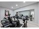 Home gym featuring modern exercise equipment and a large mirror at 4691 Pascagoula Run, Greenwood, IN 46143