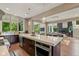Bright, open kitchen features a large island, hardwood floors, and stainless steel appliances at 4691 Pascagoula Run, Greenwood, IN 46143