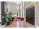 Elegant living room featuring high ceilings, large windows, hardwood floors, and bright furniture at 4691 Pascagoula Run, Greenwood, IN 46143