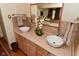 Stylish bathroom with a double vanity, vessel sinks, and a walk-in shower, creating a modern and luxurious retreat at 5135 Moller Rd, Indianapolis, IN 46254