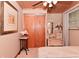 Bedroom with carpeted floors, ceiling fan, and light neutral paint at 5135 Moller Rd, Indianapolis, IN 46254
