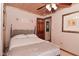 Bedroom with a queen bed, carpeted floors, ceiling fan, and light neutral paint at 5135 Moller Rd, Indianapolis, IN 46254