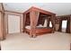 Spacious main bedroom with a four-poster bed and ample natural light at 5135 Moller Rd, Indianapolis, IN 46254