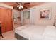 Bedroom with carpeted floors, ceiling fan, and light neutral paint at 5135 Moller Rd, Indianapolis, IN 46254