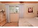 Bedroom with carpeted floors, ceiling fan, and light neutral paint at 5135 Moller Rd, Indianapolis, IN 46254
