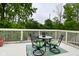 Outdoor deck showcasing a cozy seating area with a table and chairs, creating an inviting and relaxing space at 5135 Moller Rd, Indianapolis, IN 46254