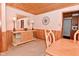 The dining room has wood paneled walls, a ceiling, and a buffet with mirror, creating a cozy atmosphere at 5135 Moller Rd, Indianapolis, IN 46254