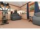 Mirrored exercise room featuring modern equipment and comfortable seating at 5135 Moller Rd, Indianapolis, IN 46254