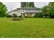 Charming two-story home features a well-manicured lawn and beautiful landscaping at 5135 Moller Rd, Indianapolis, IN 46254