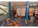 An interior view of a garage equipped with an Atlas lift system and ample room for vehicle maintenance at 5135 Moller Rd, Indianapolis, IN 46254