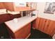 Kitchen with a desk and breakfast bar area, wood cabinets, and stainless steel refrigerator at 5135 Moller Rd, Indianapolis, IN 46254